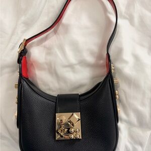 CHRISTIAN LOUBOUTIN
Carasky black mini